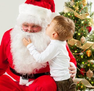 Santa Claus and Little Boy. Christmas Scene