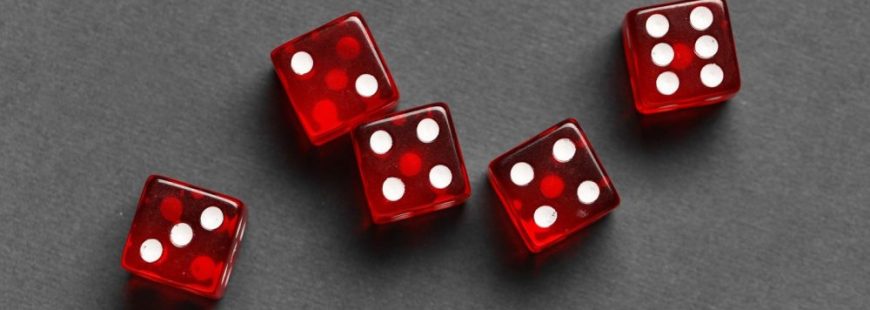 Red game dices on grey background